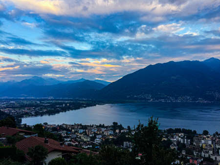 Magnificent view of the lake at sunset with the rays of the setting sun. Location-Ascona, Switzerlandの写真素材