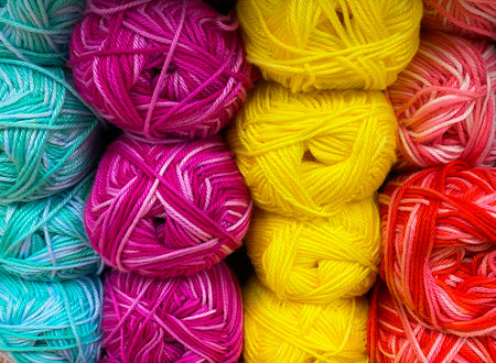 Balls of wool pink and white colors. The concept is a hobby - knitting. Fun doing handmadeの写真素材