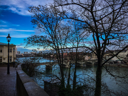 Beautiful winter afternoon with a view of the River Rhine in Basel, Switzerland. Blue Sky with Cloudsの写真素材