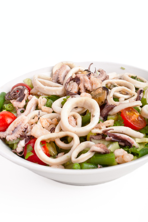 bowl of seafood salad on a white backgroundの写真素材