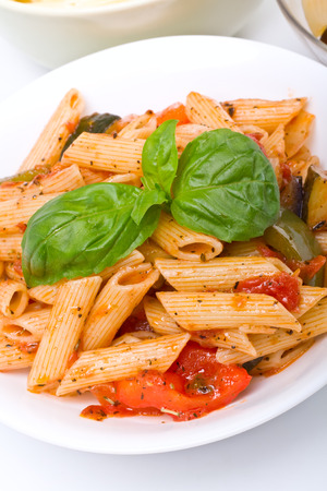 Mediterranean penne pasta in a white bowlの写真素材