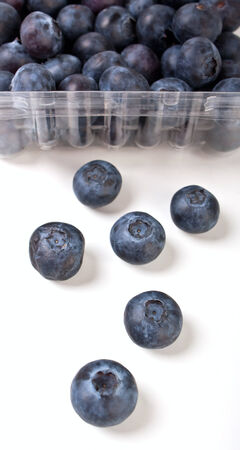 blueberries in a transparent package and six close up in frontの写真素材
