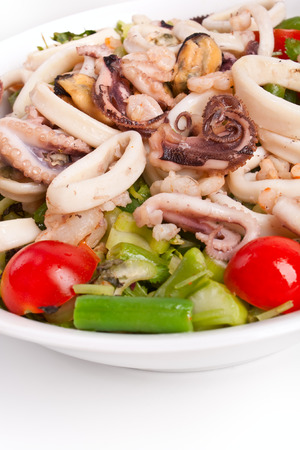 bowl of seafood salad on a white backgroundの写真素材