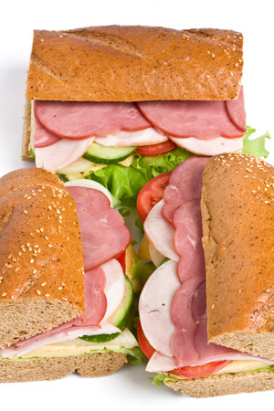 three parts of long whole wheat baguette sandwichの写真素材