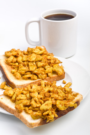 scrambled eggs on toasts and coffee breakfastの写真素材