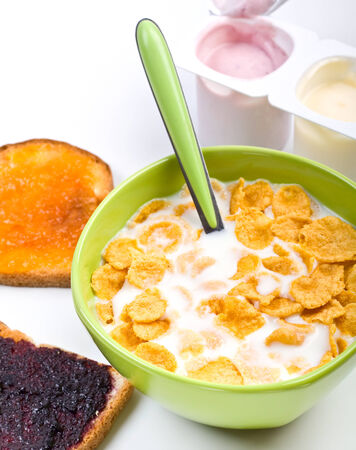 bowl of cereal with toasts and yougurtの写真素材