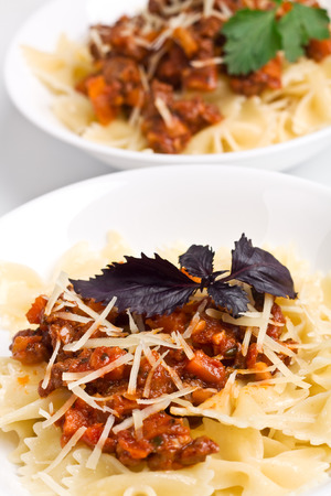 two servings of spaghetti bologneseの写真素材