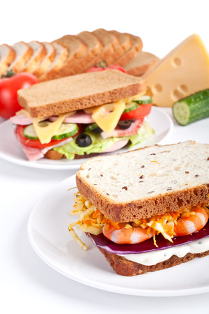 two different sandwiches with ingredientsの写真素材