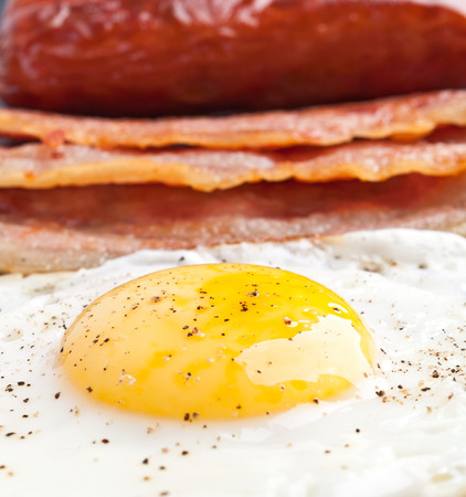 classic breakfast with fried egg, sausages, baconの写真素材