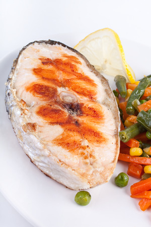 salmon steak with vegetablesの写真素材