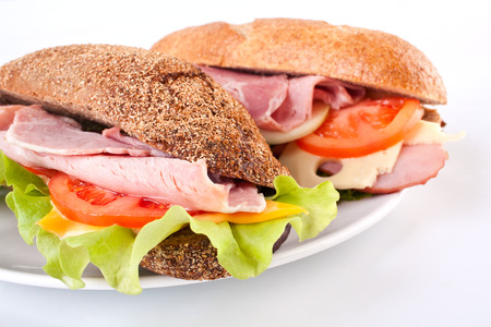 two different baguette sandwiches on plateの写真素材
