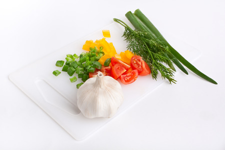 Vegetables on a plastic chopping boardの写真素材