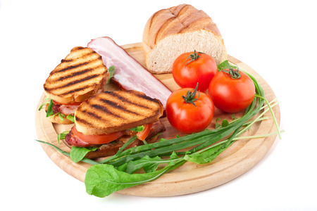 Bacon, lettuce and tomato BLT sandwich with fresh ingredients at backの写真素材