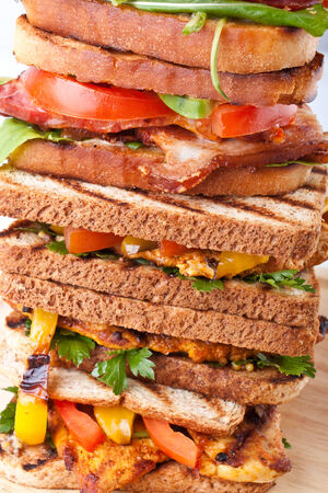 tower of grilled BTL and chicken sandwichesの写真素材