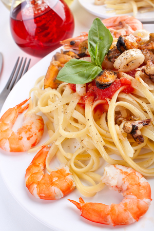 serving of pasta linguine with delicious marinara sauce and seafoodの写真素材
