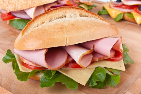submarine bun sandwich with vegetables, cheese and meatの写真素材