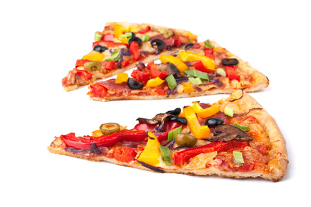 three slices of colorful vegetable pizzaの写真素材