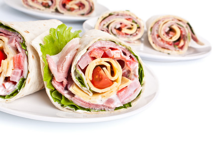 wrapped tortilla sandwich rolls cut in halfの写真素材