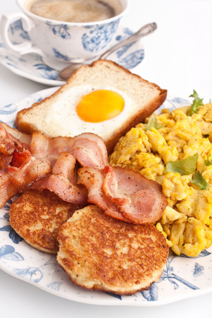 coffee, scrambled eggs, round french toasts, eggy bread and baconの写真素材