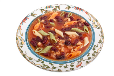 Italian minestrone soup in a plate with floral patternの写真素材
