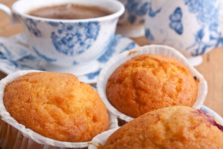 muffins with coffee in white and blue floral  patterned chinaの写真素材