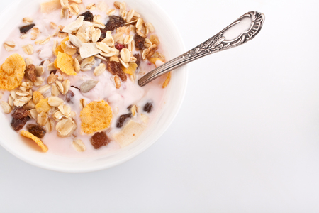 bowl of muesli on white backgroundの写真素材
