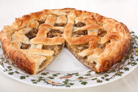 whole mushroom pie on a plate without one pieceの写真素材