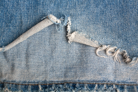 torn old blue jeans cloth texture