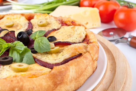 salami pizza close-up with ingredientsの写真素材