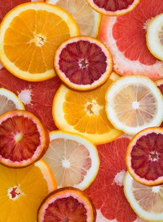 Close-up of pieces of cut citrus and to be used as a backgroundの写真素材
