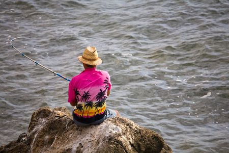 Man fishing in the seaの写真素材