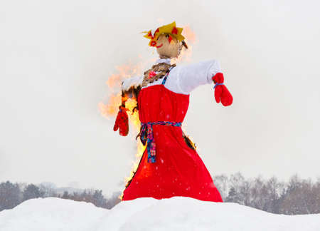 Celebration of Shrovetide traditional russian holiday, burning of a scarecrowの写真素材