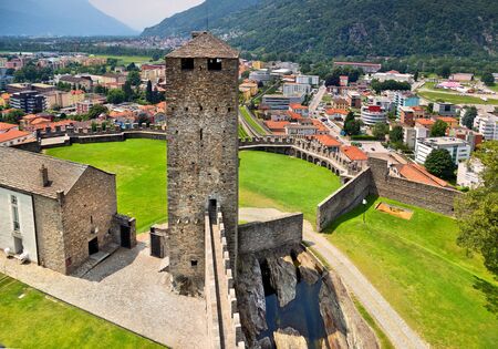 Bellinzona castles, view of the tower and wall of castle and mountains. Switzerlandのeditorial素材