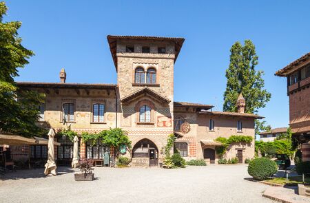 Grazzano Visconti, Italy - July 18, 2016: Grazzano Visconti - a village in medieval style, built between 1900 and 1941. Now it is a city of artisansのeditorial素材