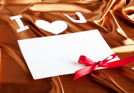 Card with "I love you" on gold silk backgroundの写真素材