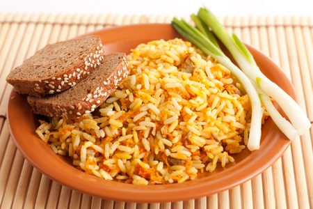 A healthy breakfast of rice, greens and corn bread   Isolated on whiteの素材 [FY31012714316]