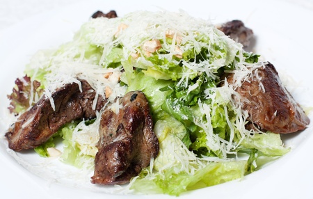 Fried liver with green salad.の写真素材