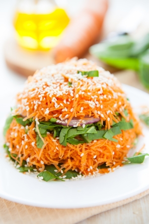 Salad of fresh carrots and spinach, close upの写真素材