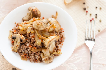 Buckwheat porridge with fried mushrooms, close-upの写真素材