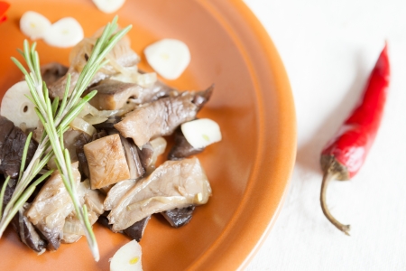 spicy fried mushrooms with garlic and herbs, closeupの写真素材