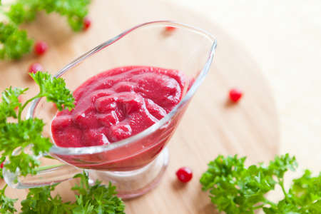 berry sauce and parsley leaves, closeupの写真素材