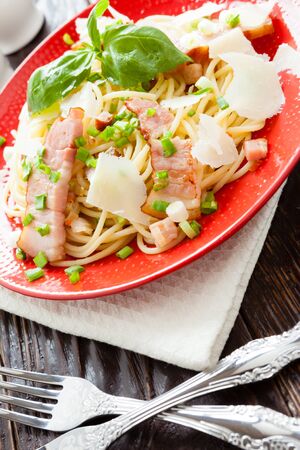 spaghetti with fried bacon and cheese, closeupの写真素材