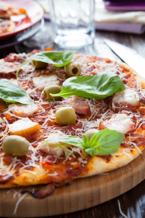 pizza with tomato sauce and bacon, closeupの写真素材