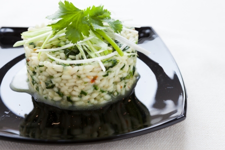 risotto with spinach on a platter, closeupの写真素材