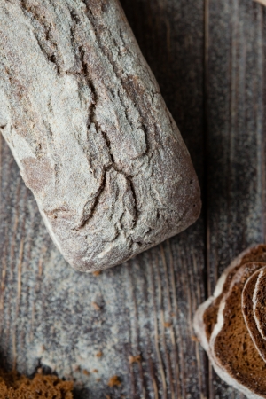 whole wheat bread with cracks on the boards, food