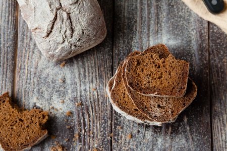 Rye bread pieces on the boards, closeup