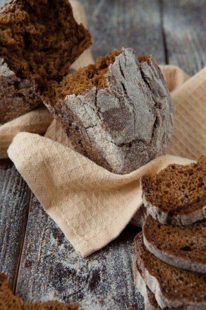 the broken brown bread on a towel,  darkの写真素材