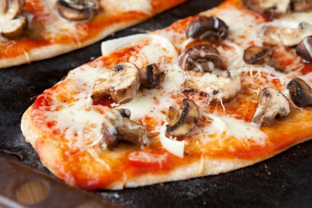 homemade pizza with mushrooms and mozzarella, foodの写真素材