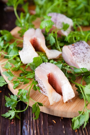 pieces of fish fillets on a cutting board, closeupの写真素材
