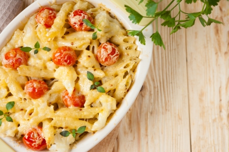 penne pasta under a cheese crust, close upの写真素材